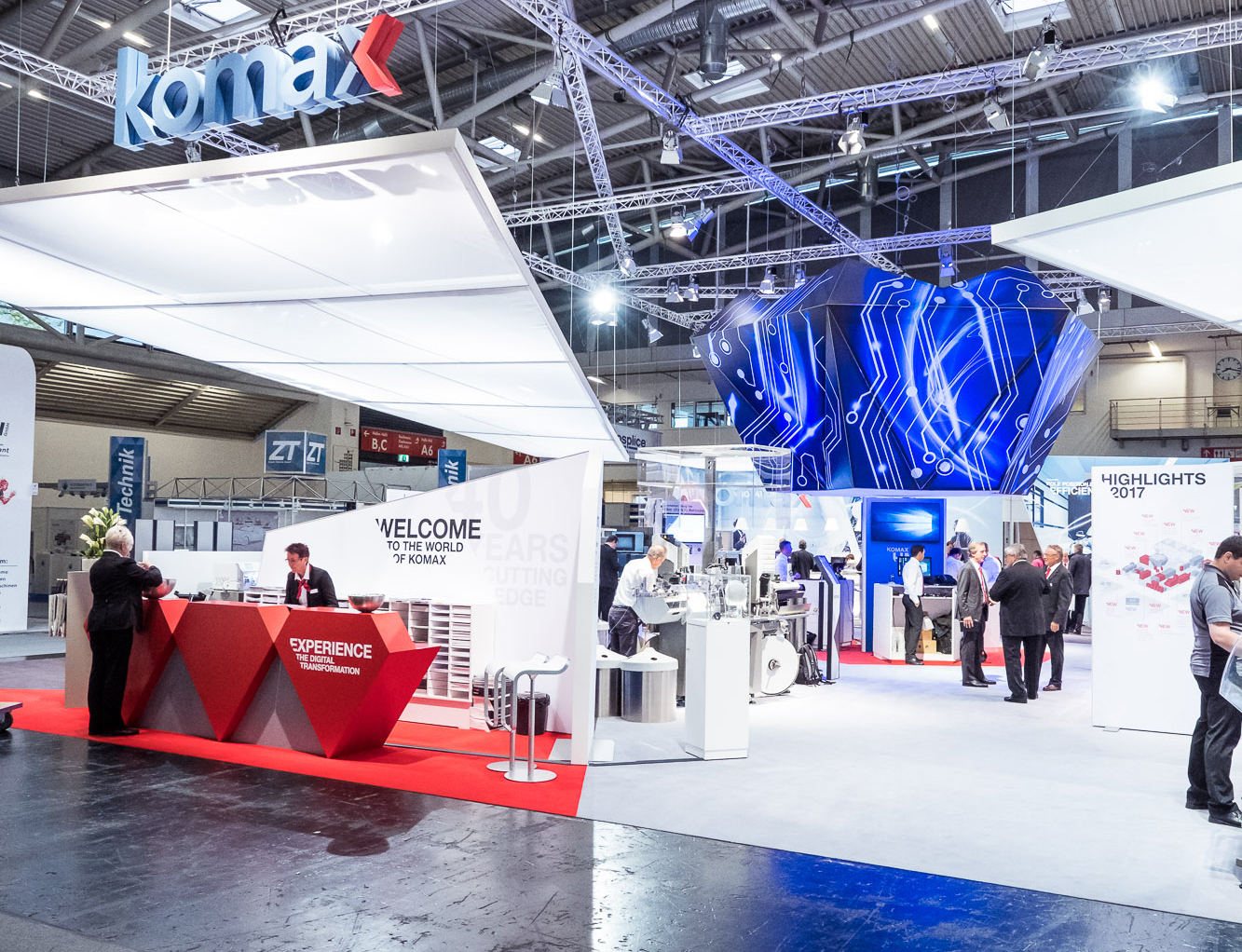 Komax Group AG - A3 Erlebnismanufaktur AG